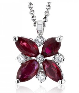 Four marquise rubies meeting at the middle with a diamond in the center along with diamonds between the rubies for a flower pendant effect