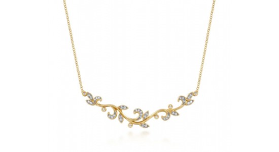 a delicate, yellow gold necklace featuring a vine motif and diamond accents