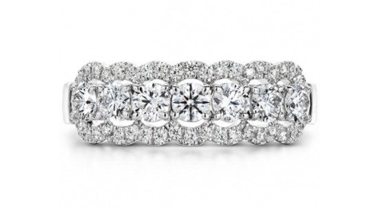a white gold fashion ring featuring seven large diamonds surrounded by smaller diamonds