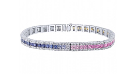 a diamond line bracelet featuring diamonds in a spectrum of colors