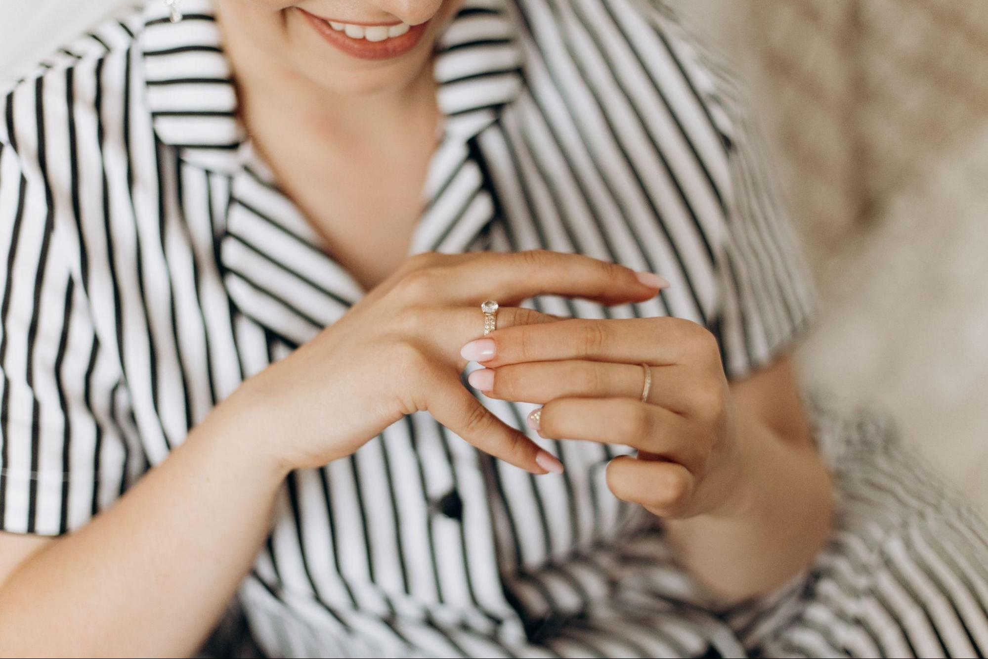 lady smiling and wearing a wedding band